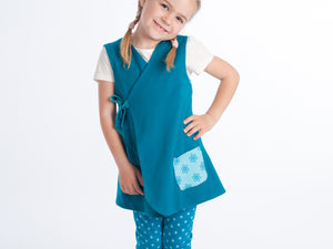 Lined baby tunic wrap dress pattern for girls. Easy sewing reversible dress with or without sleeves. Paper pattern MARIE by Patternforkids - Patternforkids